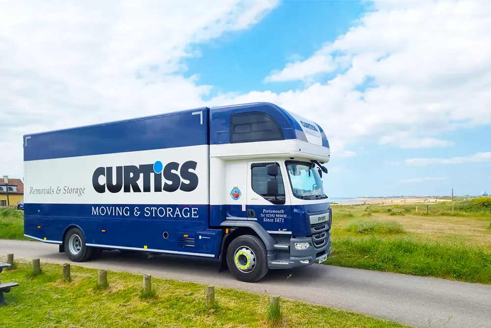 Curtiss moving & storage company truck moving home in Portsmouth